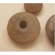 Clay figure, six-pointed sun symbol